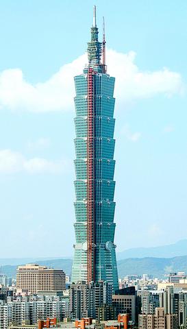 At a ceremony witnessed by officials and business leaders, a 60-metre (197-ft) spire capped the 101-storey structure Taipei 101, unseating Kuala Lumpur's 452 meters (1,483 feet) Petronas Towers as the world's tallest building at height of 508 metres (1,667 feet), Taipei, Taiwan, October 17, 2003.